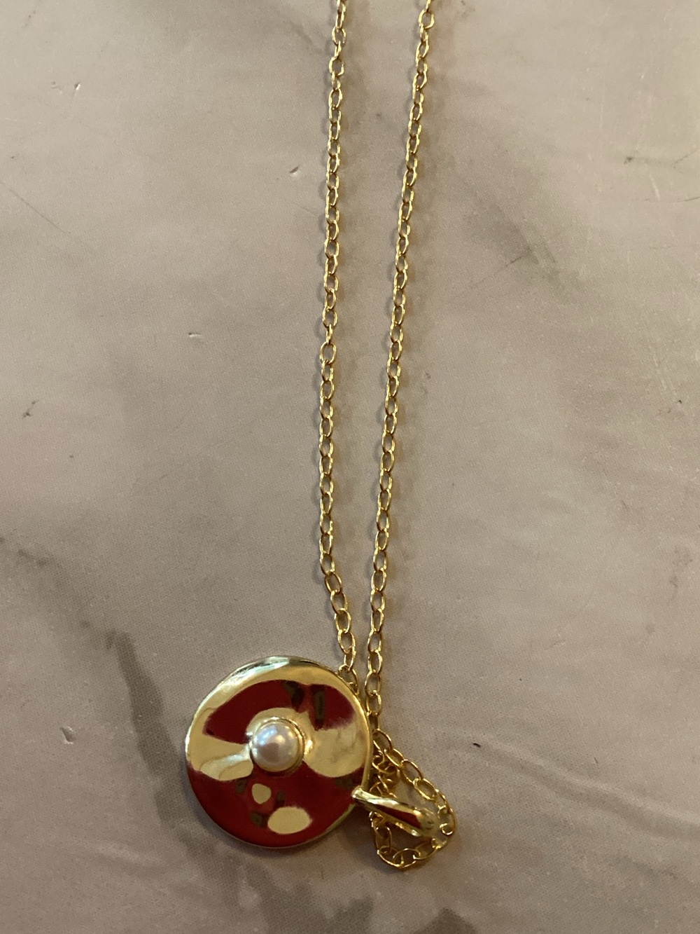 Rook and.Bloom Thin gold chain with a oval dish shaped charm inset